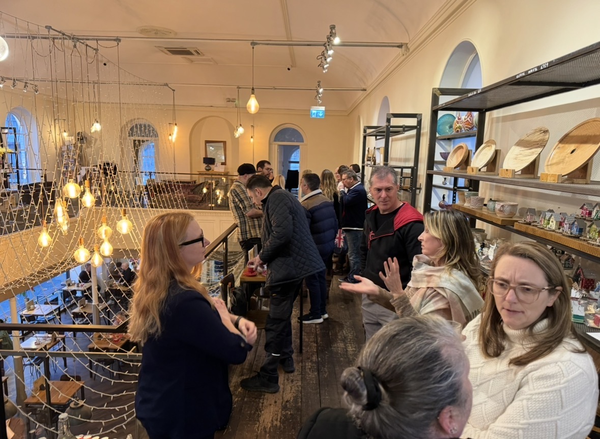 Isle of Wight business owners chatting at a networking morning at Caffè Isola